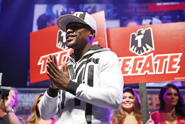 Boxer Floyd Mayweather Jr. speaks during an arrival ceremony Tuesday, April 28, 2015, in Las Vegas. Mayweather will face Manny Pacquiao in a welterweight boxing match in Las Vegas on May 2. (AP Photo/John Locher)