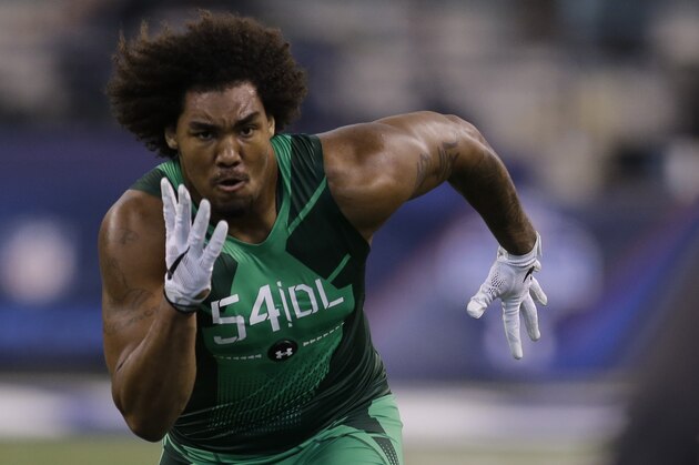 USC defensive lineman Leonard Williams runs a drill at the NFL football scouting combine in Indianapolis, Sunday, Feb. 22, 2015. (AP Photo/Julio Cortez)