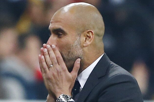 Bayern's head coach Pep Guardiola reacts during the German soccer cup (DFB Pokal) semifinal match between FC Bayern Munich and Borussia Dortmund at the Allianz Arena in Munich, Germany, on Tuesday, April 28, 2015. (AP Photo/Matthias Schrader)
