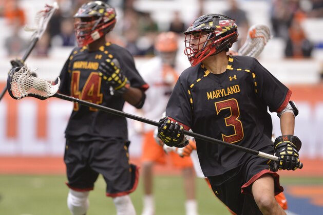 Feb 22, 2014; Syracuse, NY, USA; Maryland Terrapins defenseman Casey Ikeda (3) carries the ball during the second quarter of a game against the Syracuse Orange at the Carrier Dome. Mandatory Credit: Mark Konezny-USA TODAY Sports