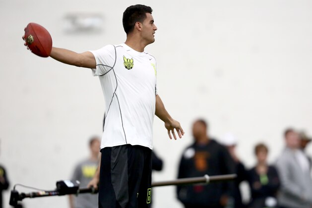 Oregon's Marcus Mariota warms up during Pro Day at the University of Oregon, Thursday, March 12, 2015, in Eugene, Ore. (AP Photo/Ryan Kang)