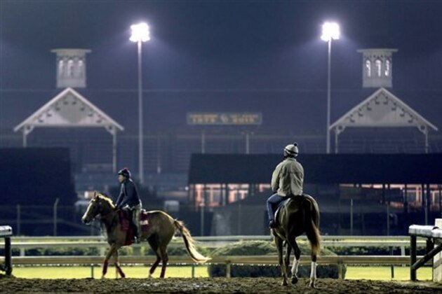 Horses train during an early during morning workout at Churchill Downs Wednesday, April 29, 2015, in Louisville, Ky. (AP Photo/Charlie Riedel)
