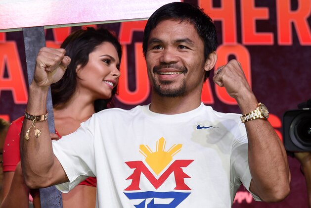 LAS VEGAS, NV - APRIL 28:  WBO welterweight champion Manny Pacquiao poses during a fan rally at the Mandalay Bay Convention Center on April 28, 2015 in Las Vegas, Nevada. Pacquiao will face WBC/WBA welterweight champion Floyd Mayweather Jr. in a unification bout on May 2, 2015 in Las Vegas.  (Photo by Ethan Miller/Getty Images)