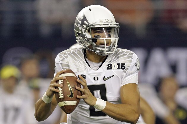 Oregon's Marcus Mariota during the first half of the NCAA college football playoff championship game against Ohio State Monday, Jan. 12, 2015, in Arlington, Texas. (AP Photo/Eric Gay)