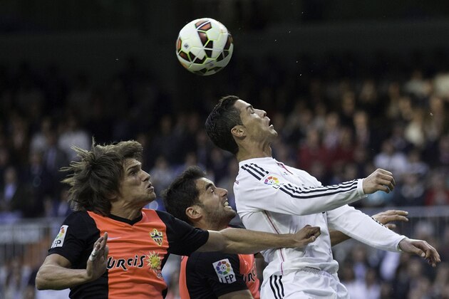 MADRID, SPAIN - APRIL 29: Cristiano Ronaldo of Real Madrid CF wins the header after Sebastian Dubarbier of Almeria UD during the La Liga match between Real Madrid CF and UD Almeria at Estadio Santiago Bernabeu on April 29, 2015 in Madrid, Spain. (Photo by Gonzalo Arroyo Moreno/Getty Images) MADRID, SPAIN - APRIL 29: Cristiano Ronaldo of Real Madrid CF wins the header after Sebastian Dubarbier of Almeria UD during the La Liga match between Real Madrid CF and UD Almeria at Estadio Santiago Bernabeu on April 29, 2015 in Madrid, Spain. (Photo by Gonzalo Arroyo Moreno/Getty Images)