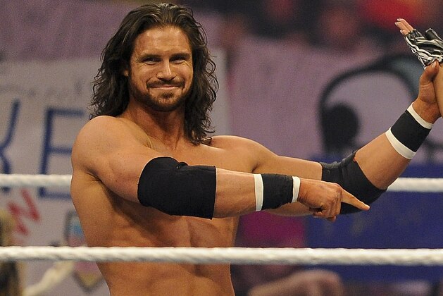 John Morrison and Trish Stratus raise Nicole