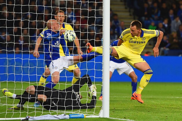LEICESTER, ENGLAND - APRIL 29:  John Terry of Chelsea scores their second goal past Kasper Schmeichel of Leicester City during the Barclays Premier League match between Leicester City and Chelsea at The King Power Stadium on April 29, 2015 in Leicester, England.  (Photo by Michael Regan/Getty Images)