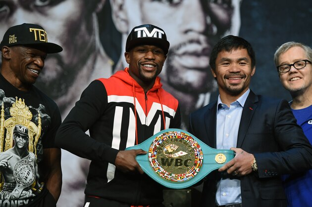 LAS VEGAS, NV - APRIL 29:  (L-R) Trainer Floyd Mayweather Sr. looks on as WBC/WBA welterweight champion Floyd Mayweather Jr. and WBO welterweight champion Manny Pacquiao pose with a WBC championship belt as Pacquiao's trainer Freddie Roach looks on during a news conference at the KA Theatre at MGM Grand Hotel & Casino on April 29, 2015 in Las Vegas, Nevada. The two will face each other in a unification bout on May 2, 2015 in Las Vegas.  (Photo by Ethan Miller/Getty Images)