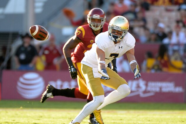 LOS ANGELES, CA - NOVEMBER 29:  William Fuller #7 of the Notre Dame Fighting Irish prepares to catch a pass in front of Gerald Bowman #27 of the USC Trojans during the third quarter at Los Angeles Memorial Coliseum on November 29, 2014 in Los Angeles, California.  (Photo by Harry How/Getty Images)