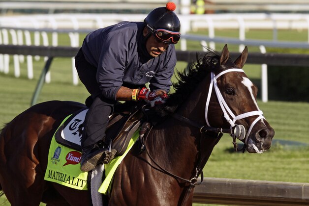 Kentucky Derby hopeful Materiality, ridden by exercise rider Carlos Cano, gallops during a morning workout at Churchill Downs in Louisville, Ky., Monday, April 27, 2015.  (AP Photo/Garry Jones)