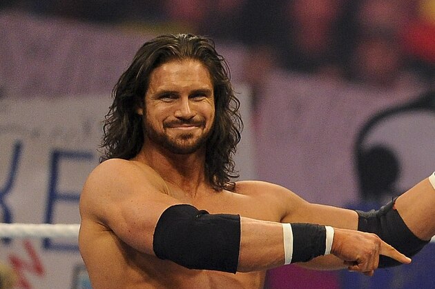 John Morrison and Trish Stratus raise Nicole