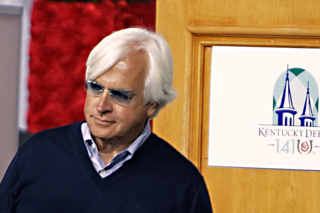 Hall of Fame trainer Bob Baffert looks for a spot to sit before the start of the Kentucky Derby post position draw at Churchill Downs in Louisville, Ky., Wednesday, April 29, 2015.  (AP Photo/Garry Jones)