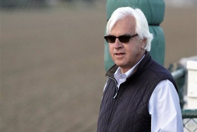 ADVANCE FOR WEEKEND EDITIONS, APRIL 25-26 - In this May 17, 2014, file photo, Hall of Fame trainer Bob Baffert watches his Preakness Stakes entrant, Bayern gallop at Pimlico Race Course in Baltimore. Trainers Todd Pletcher and Baffert are taking aim at the Kentucky Derby with a combined seven horses among the expected full field of 20. While Pletcher has the bigger numbers, Baffert may have the better talent. The Hall of Fame trainer is going after his fourth Derby victory with a pair of aces — undefeated Dortmund and precocious American Pharoah. (AP Photo/Garry Jones, File)