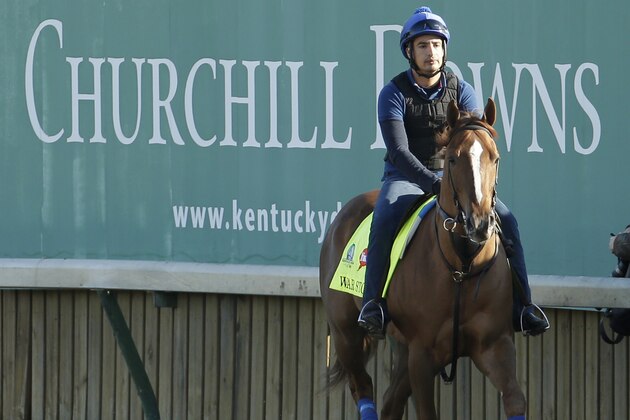Exercise rider Dylan Davis rides Kentucky Derby hopeful War Story during morning workouts at Churchill Downs Monday, April 27, 2015, in Louisville, Ky. (AP Photo/Charlie Riedel)
