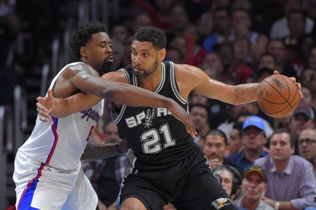 San Antonio Spurs forward Tim Duncan, right, tries to get by Los Angeles Clippers center DeAndre Jordan during the second half of Game 5 of a first-round NBA basketball playoff series, Tuesday, April 28, 2015, in Los Angeles. The Spurs won 111-107. (AP Photo/Mark J. Terrill)
