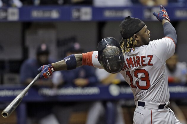 Boston Red Sox's Hanley Ramirez loses his helmet as he swings during the eighth inning of a baseball game against the Tampa Bay Rays Thursday, April 23, 2015, in St. Petersburg, Fla. (AP Photo/Chris O'Meara)