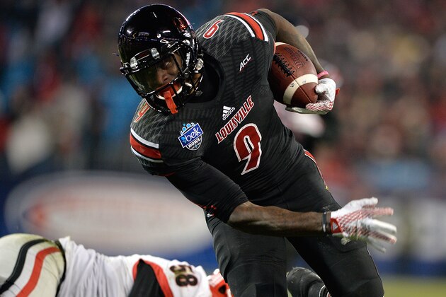 CHARLOTTE, NC - DECEMBER 30:  DeVante Parker #9 of the Louisville Cardinals makes a catch against Jordan Jenkins #59 of the Georgia Bulldogs during the Belk Bowl at Bank of America Stadium on December 30, 2014 in Charlotte, North Carolina. Georgia won 37-14.  (Photo by Grant Halverson/Getty Images)