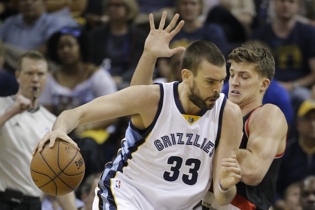 Memphis Grizzlies center Marc Gasol (33), of Spain, drives against Portland Trail Blazers center Meyers Leonard in the first half of Game 5 of an NBA basketball playoff series Wednesday, April 29, 2015, in Memphis, Tenn. (AP Photo/Mark Humphrey)