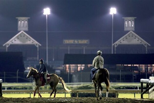 Horses train during an early during morning workout at Churchill Downs Wednesday, April 29, 2015, in Louisville, Ky. (AP Photo/Charlie Riedel)