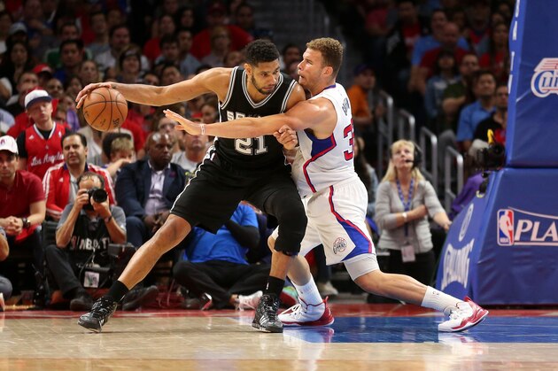 LOS ANGELES, CA - APRIL 28:  Tim Duncan #21 of the San Antonio Spurs controls the ball against Blake Griffin #32 of the Los Angeles Clippers during Game Five of the Western Conference quarterfinals of the 2015 NBA Playoffs at Staples Center on April 28, 2015 in Los Angeles, California. NOTE TO USER: User expressly acknowledges and agrees that, by downloading and or using this photograph, User is consenting to the terms and conditions of the Getty Images License Agreement.  (Photo by Stephen Dunn/Getty Images)