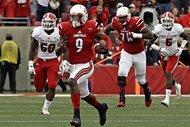 Louisville wide receiver DeVante Parker (9) gets loose in the North Carolina State secondary for a 37-yard completion in the NCAA college football game Saturday, Oct. 18, 2014 in Louisville, Ky. (AP Photo/Garry Jones)