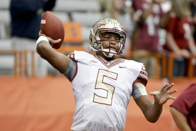 Florida State quarterback Jameis Winston (5) warms up before an NCAA college football game against the Syracuse Saturday, Oct. 11, 2014, in Syracuse, N.Y. (AP Photo/Frank Franklin II)