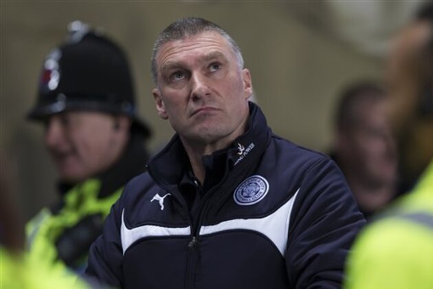 FILE - A Wednesday March 4, 2015 photo from files of Leicester's manager Nigel Pearson as he takes to the touchline before his team's English Premier League soccer match between Manchester City and Leicester City at the Etihad Stadium, Manchester, England. For a man who once repelled a pack of vicious dogs while hiking in the Carpathian Mountains, handling an innocuous question in a news conference should have been easy for the manager. Instead, a lengthy rant at a reporter has left Nigel Pearson under more scrutiny in a season in which the normally unflappable coach has lost his cool several times while his team struggles to avoid relegation. In an uncomfortable verbal altercation, Pearson used an expletive, called the reporter “daft” and “stupid” and said he was an “ostrich” with his “head in the sand.” (AP Photo/Jon Super, File)