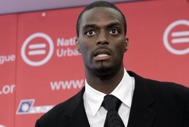 Plaxico Burress, the 33-year-old former New York Giants receiver, responds to a question during a news conference in New York,  Monday, June 13, 2011. Burress will work with the National Urban League and Brady Center to Prevent Gun Violence,  after spending nearly two years in prison on a weapon possession charge. (AP Photo/Richard Drew)