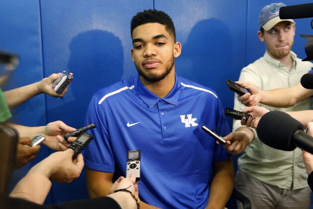 Kentucky NCAA college basketball player Karl-Anthony Towns listens to a reporters question after announcing his intent to place his name in the NBA draft during a news conference at the Joe Craft Center, Thursday, April 9, 2015, in Lexington, Ky. (AP Photo/James Crisp)