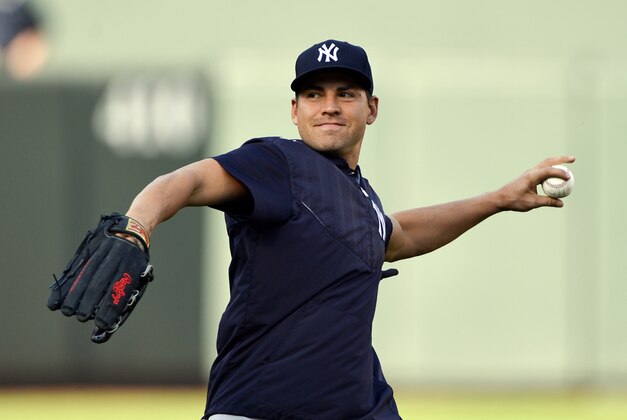 Apr 13, 2015; Baltimore, MD, USA; New York Yankees center fielder Jacoby Ellsbury (22) throws during warm up for the game against the Baltimore Orioles at Oriole Park at Camden Yards. Mandatory Credit: Tommy Gilligan-USA TODAY Sports