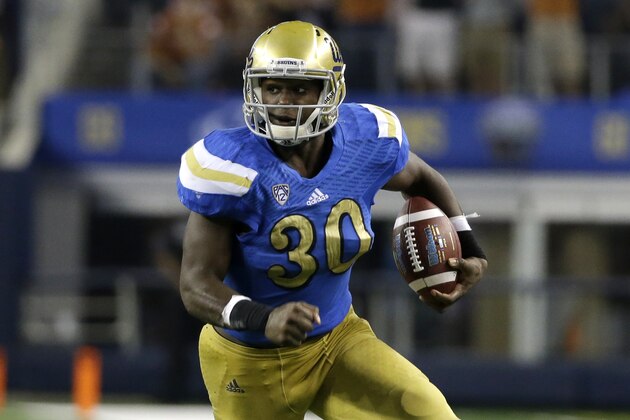UCLA linebacker Myles Jack (30) finds running room against Texas during an NCAA college football game, Saturday, Sept. 13, 2014, in Arlington, Texas. (AP Photo/Tony Gutierrez)