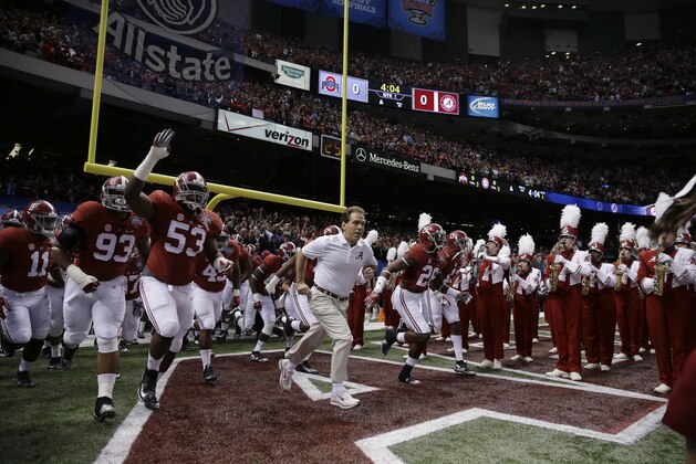 Alabama head coach Nick Saban leads the team to the field before the Sugar Bowl NCAA college football playoff semifinal game against Ohio State, Thursday, Jan. 1, 2015, in New Orleans. (AP Photo/Brynn Anderson)