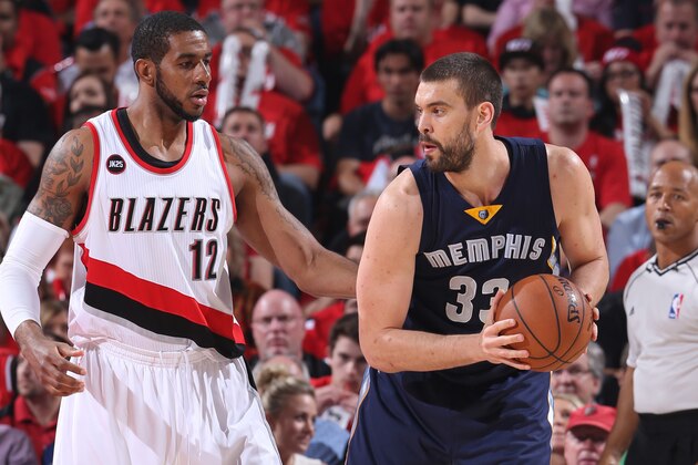 PORTLAND, OR - APRIL 27:  Marc Gasol #33 of the Memphis Grizzlies looks to drive to the basket against LaMarcus Aldridge #12 of the Portland Trail Blazers in Game Four of the Western Conference Quarterfinals during the 2015 NBA Playoffs on April 27, 2015 at the Moda Center in Portland, Oregon. NOTE TO USER: User expressly acknowledges and agrees that, by downloading and or using this photograph, User is consenting to the terms and conditions of the Getty Images License Agreement. Mandatory Copyright Notice: Copyright 2015 NBAE (Photo by Sam Forencich/NBAE via Getty Images)