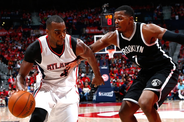 ATLANTA, GA - APRIL 29:  Paul Millsap #4 of the Atlanta Hawks drives against Joe Johnson #7 of the Brooklyn Nets during Game Five of the Eastern Conference Quarterfinals of the NBA Playoffs at Philips Arena on April 29, 2015 in Atlanta, Georgia.  NOTE TO USER: User expressly acknowledges and agrees that, by downloading and/or using this photograph, user is consenting to the terms and conditions of the Getty Images License Agreement.  (Photo by Kevin C. Cox/Getty Images)