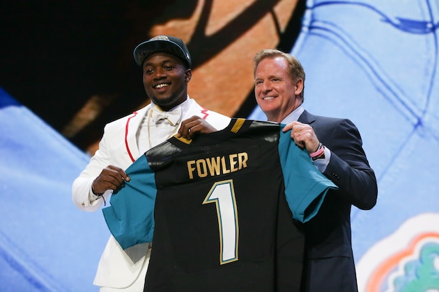 CHICAGO, IL - APRIL 30:  Dante Fowler Jr. of the Florida Gators holds up a jersey with NFL Commissioner Roger Goodell after being chosen #3 overall by the Jacksonville Jaguars during the first round of the 2015 NFL Draft at the Auditorium Theatre of Roosevelt University on April 30, 2015 in Chicago, Illinois.  (Photo by Jonathan Daniel/Getty Images)