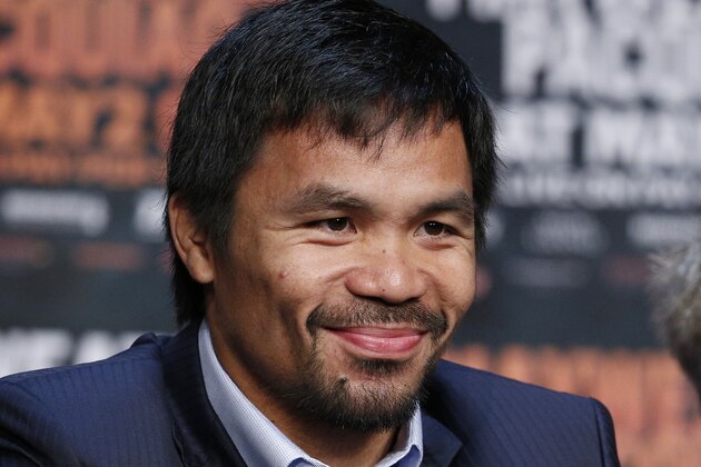 Manny Pacquiao smiles during a news conference Wednesday, April 29, 2015, in Las Vegas. Pacquiao will face Floyd Mayweather Jr. in a welterweight boxing match in Las Vegas on May 2. (AP Photo/John Locher)