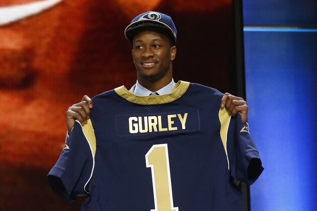 Georgia running back Todd Gurley poses for photos after being selected by the St. Louis Rams as the 10th pick in the first round of the 2015 NFL Draft,  Thursday, April 30, 2015, in Chicago. (AP Photo/Charles Rex Arbogast)
