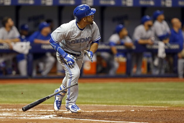 Toronto Blue Jays Devon Travis watches his solo home run during the fourth inning of a baseball game against the Tampa Bay Rays on Friday, April 24, 2015, in St. Petersburg, Fla. (AP Photo/Mike Carlson)