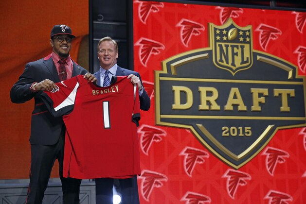 Clemson defensive lineman Vic Beasley poses for photos with NFL commissioner Roger Goodell after being selected by the Atlanta Falcons as the eighth pick in the first round of the 2015 NFL Draft,  Thursday, April 30, 2015, in Chicago. (AP Photo/Charles Rex Arbogast)