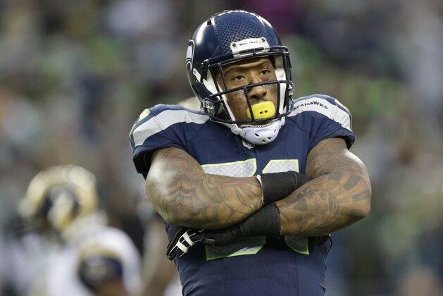 FILE - This Dec. 28, 2014, file photo shows Seattle Seahawks linebacker Bruce Irvin reacting after he broke up a pass attempt by St. Louis Rams quarterback Shaun Hill  in the second half of an NFL football game in Seattle. Once thought to be a risky first-round draft pick and a one-trick pony in the NFL that could only rush the passer, Bruce Irvin has developed into a defensive player that never leaves the field. (AP Photo/Scott Eklund, File)