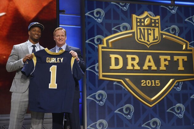 Georgia running back Todd Gurley poses for photos with NFL commissioner Roger Goodell after being selected by the St. Louis Rams as the 10th pick in the first round of the 2015 NFL Draft,  Thursday, April 30, 2015, in Chicago. (AP Photo/Charles Rex Arbogast)