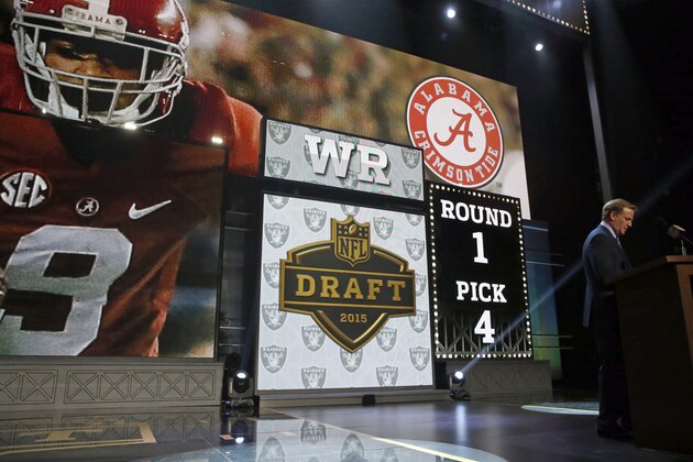 NFL commissioner Roger Goodell announces after the Oakland Raiders selects Alabama wide receiver Amari Cooper as the fourth pick in the first round of the 2015 NFL Draft,  Thursday, April 30, 2015, in Chicago. (AP Photo/Charles Rex Arbogast)
