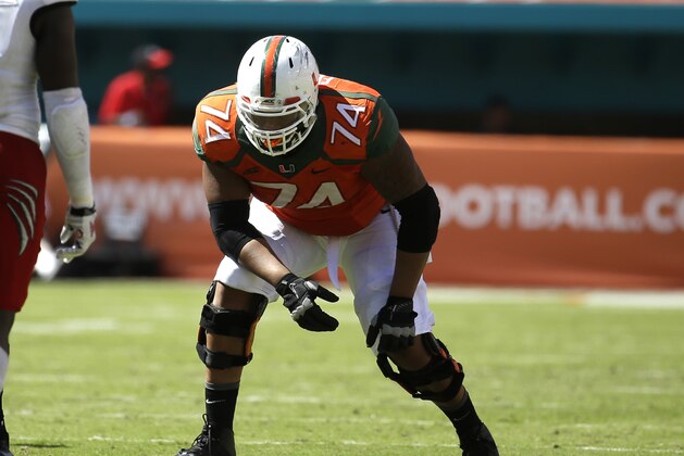 Miami Hurricanes offensive lineman Ereck Flowers (74) lines up on the field in the first half of an NCAA college football game against Cincinnati, Saturday, Oct. 11, 2014, in Miami Gardens, Fla. Miami defeated Cincinnati 55-34. (AP Photo/Lynne Sladky)