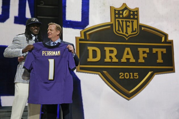 Central Florida wide receiver Breshad Perriman poses for photos with NFL commissioner Roger Goodell after being selected by the Baltimore Ravens as the 26th pick in the first round of the 2015 NFL Draft,  Thursday, April 30, 2015, in Chicago. (AP Photo/Charles Rex Arbogast)
