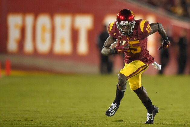 Southern California wide receiver Nelson Agholor runs the ball during the first half of an NCAA college football game against California, Thursday, Nov. 13, 2014, in Los Angeles. (AP Photo/Mark J. Terrill)