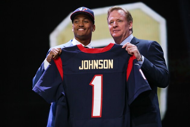 CHICAGO, IL - APRIL 30:  Kevin Johnson of the Wake Forest Demon Deacons holds up a jersey with NFL Commissioner Roger Goodell after being picked #16 overall by the Houston Texans during the first round of the 2015 NFL Draft at the Auditorium Theatre of Roosevelt University on April 30, 2015 in Chicago, Illinois.  (Photo by Jonathan Daniel/Getty Images)
