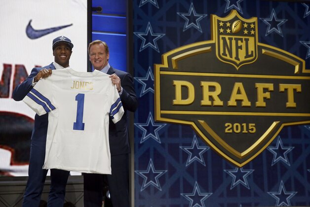 Connecticut defensive back Byron Jones poses for photos with NFL commissioner Roger Goodell after being selected by the Dallas Cowboys as the 27th pick in the first round of the 2015 NFL Draft,  Thursday, April 30, 2015, in Chicago. (AP Photo/Charles Rex Arbogast)
