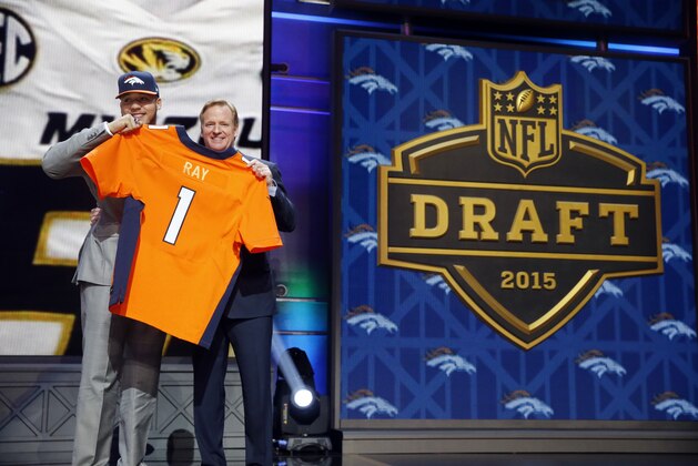 Missouri defensive lineman Shane Ray poses for photos with NFL commissioner Roger Goodell after being selected by the Denver Broncos as the 23rd pick in the first round of the 2015 NFL Draft,  Thursday, April 30, 2015, in Chicago. (AP Photo/Charles Rex Arbogast)