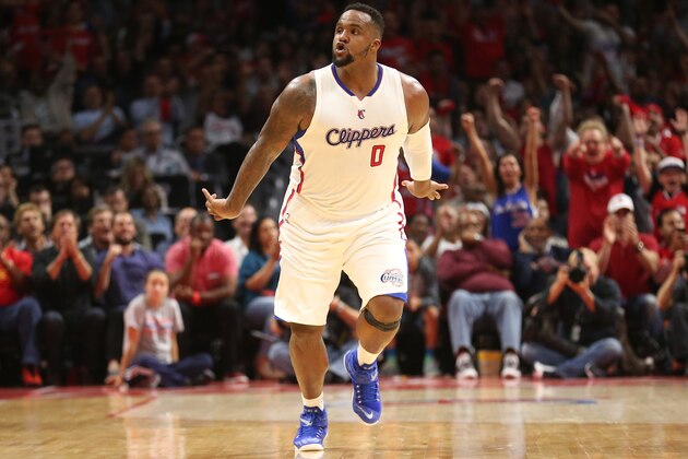 LOS ANGELES, CA - APRIL 28:  Glen Davis #0 of the Los Angeles Clippers celebrates after making a basket against the San Antonio Spurs during Game Five of the Western Conference quarterfinals of the 2015 NBA Playoffs at Staples Center on April 28, 2015 in Los Angeles, California.  The Spurs won 111-107.  NOTE TO USER: User expressly acknowledges and agrees that, by downloading and or using this photograph, User is consenting to the terms and conditions of the Getty Images License Agreement.  (Photo by Stephen Dunn/Getty Images)