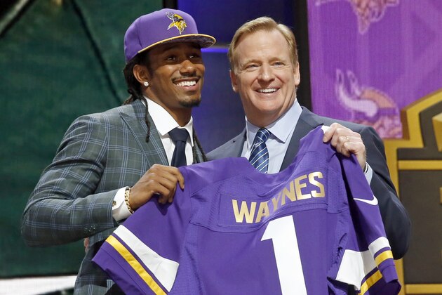 Michigan State defensive back Trae Waynes poses for photos with NFL commissioner Roger Goodell after being selected by the Minnesota Vikings as the 11th pick in the first round of the 2015 NFL Draft,  Thursday, April 30, 2015, in Chicago. (AP Photo/Charles Rex Arbogast)
